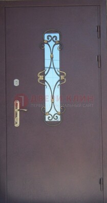 Металлическая дверь со стеклом и ковкой ДСК-77 в Троицке